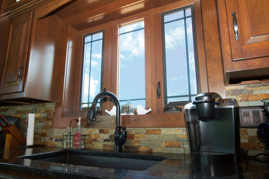 three casement windows installed behind kitchen sink springfield illinois