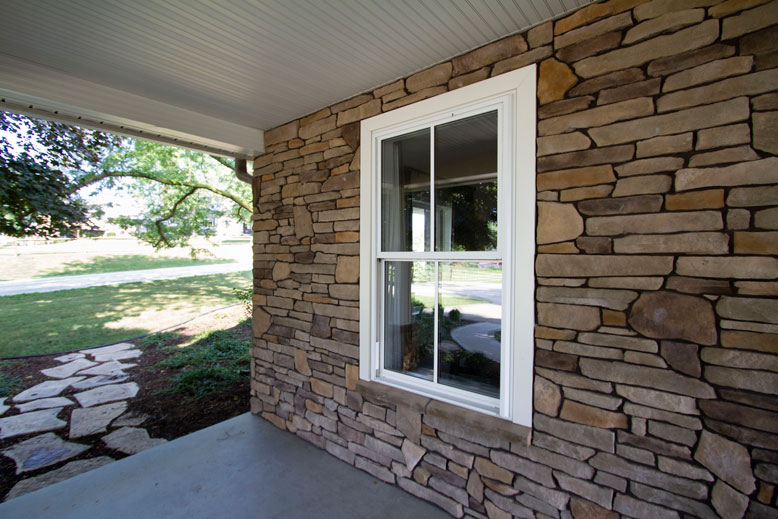 double-hung window installed on a house with stone siding springfield illinois