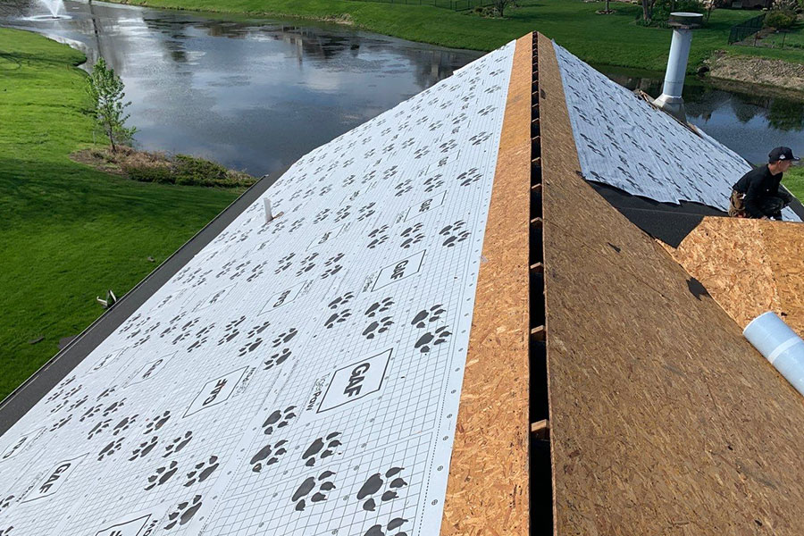 A protective layer of weatherproofing material that is installed on the deck of a residential roof in Springfield, IL. Ice and water shield installed under roof shingles.