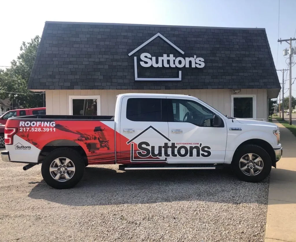 suttons truck parked in front of office