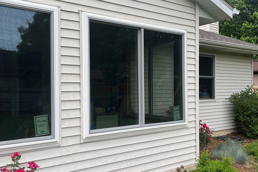 The exterior of a home in Springfield, IL, with a focus on the replacement windows.