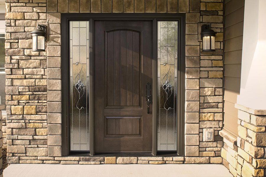 A professionally installed entry door designed with wood and glass on a residence in Chatham, IL.