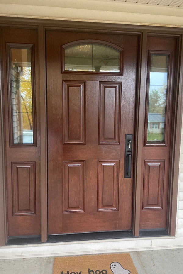 A beautiful wooden door expertly installed on the front of a home in Chatham, IL.