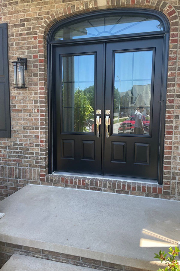 A new entry door set in a brick home in Chatham, IL.