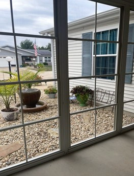 This is a photo of newly installed porch windows in Springfield, IL by Sutton’s.