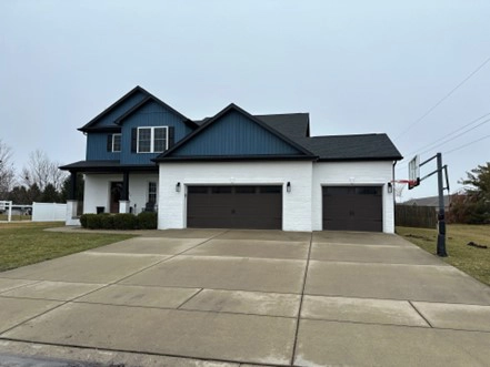 This is a photo of a house in Chatham, IL with newly installed siding by Sutton’s.