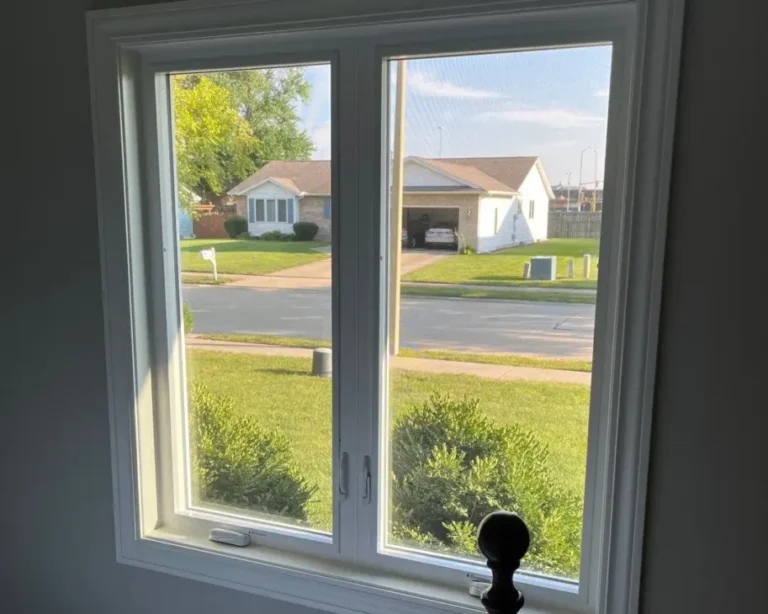 Interior view of a bedroom with a pair of new casement windows installed by Sutton’s in Springfield IL